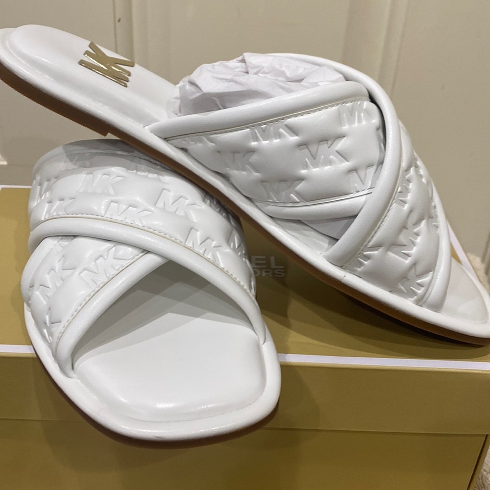 Michael Kors embossed initial white leather slip ons